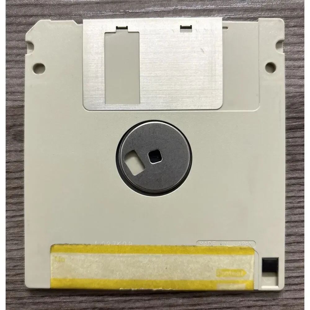 Vintage Toshiba T1100 Plus Laptop Computer with Maxell Micro Floppy Disk MF 2-DD
